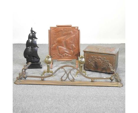 An Art Deco cast iron companion set in the form of a galleon, 60cm high, together with a brass coal box, a fire screen a pair