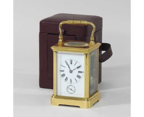 A mid 20th century brass cased carriage clock, with a white enamel dial, 11cm high, in a fitted case, with keyCondition repor