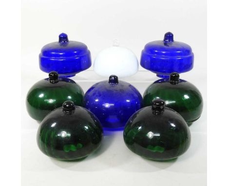 A collection of eight coloured glass lamp fonts, largest 15cm diameter