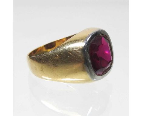 An 18 carat gold ruby coloured gem set signet ring, 6.1g gross, size JCondition report: Has been worn so has wear to both the