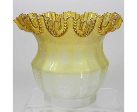 A yellow and clear glass oil lamp shade, with a frilled rim and etched with stylised flowers, 18cm highCondition report: 11cm