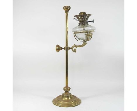 A 19th century brass student's lamp, with an adjustable height, on a weighted base, 64cm high overall