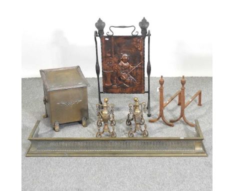 A pierced brass fender, 125cm, together with two pairs of fire dogs, a coal box and a fire screen
