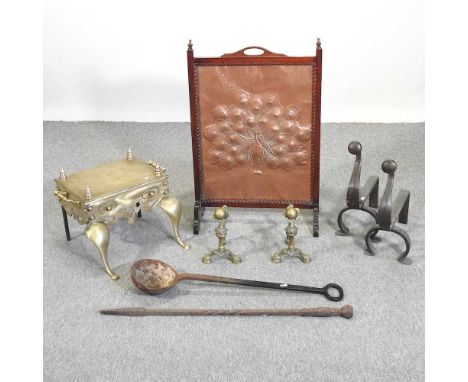 A brass footman, 46cm, together with two pairs of fire dogs, a fire screen, a poker and a blacksmith's smelting ladle