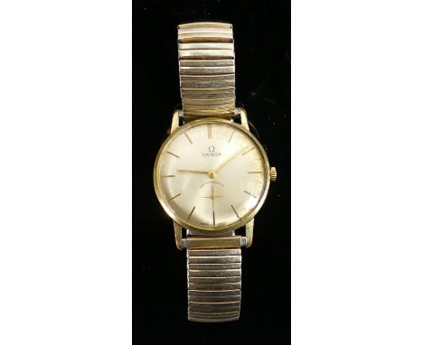 Omega antimagnetic gentlemans vintage wristwatch: gold plated and stainless steel with expandable bracelet. 