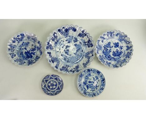 A collection of 17th century Kangxi period blue and white porcelain dishes: Comprising  of a set of 3 graduated dishes and tw