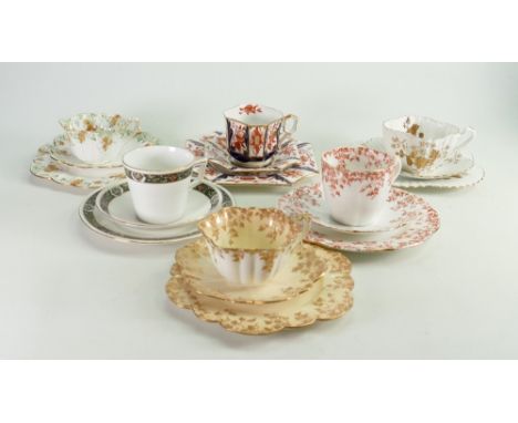 A collection of Wileman and Co trios including: Square 3476 Japan, Alexandra 3981 Gold Aster, Lily 5097 Red Ivy, Victoria 107