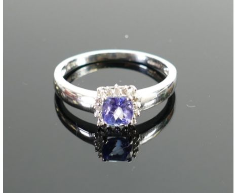 18ct white gold ladies ring :set with cushion cut blue tanzanite stone surrounded by diamonds, ring size R,3.1g. (with Anchor