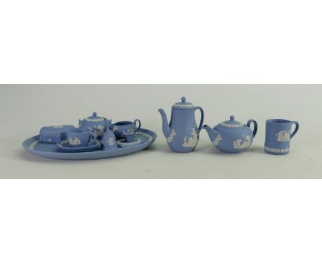 A collection of miniature Wedgwood items to include: Tea &amp; coffee pots, cream, sugar &amp; teacup, dressing table part se