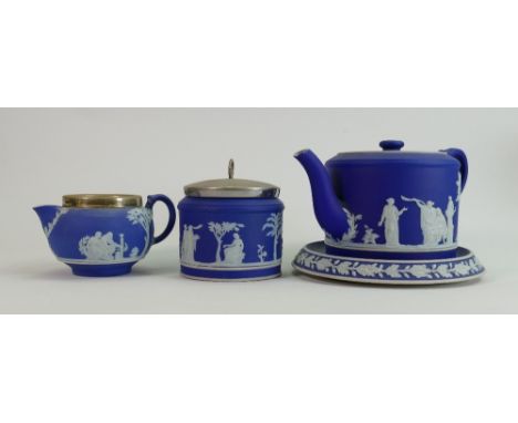 Wedgwood dip blue tea service: Nip noted to end of spout, complete with tea pot stand. 