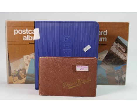 A collection of vintage postcards: 4 albums containing postcards, memorabilia and photographs of mainly old ships, boats etc.