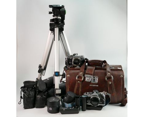 A large collection of Olympus OM 35mm camera equipment to include: OM-2N MD camera bodies x 2, OM Winder 2 x 2, OM Zuiko MC A