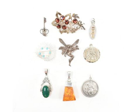 An assorted collection of silver brooch pins &amp; necklace pendants. The lot to include; amber specimen pendant (925), red s