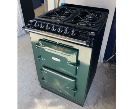 An AGA 4/2 Series dual fuel oven with four burner gas hob and cast iron pan supports including wok ring, single fan oven and 