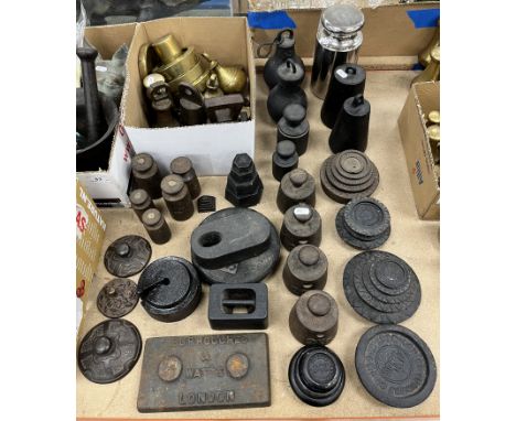 A collection of various cast iron and brass weights to include a 10 kg chrome plated cylindrical weight, cast iron 2 kg weigh