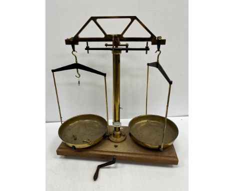 A pair of brass mid 20th Century laboratory scales with ivorine label inscribed "Baird & Tatlock (London) Ltd ..." together w