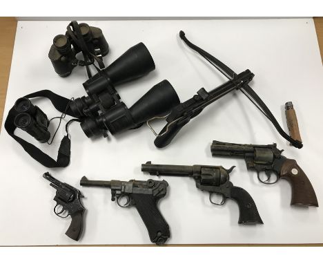 A Taiwanese crossbow pistol, three various replica pistols including a Python 357, Magnum, Luger and Colt 45 and another Ital