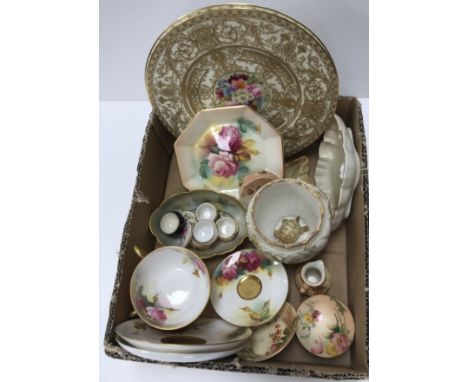 A box containing a small collection of Royal Worcester porcelain wares to include a pair of rose decorated and gilt teacups a