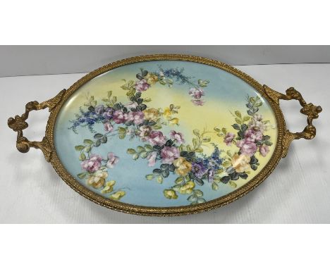 A Limoges porcelain tray with gilt metal mounts, the centre field decorated with floral spray, indistinctly signed "Hezic?", 