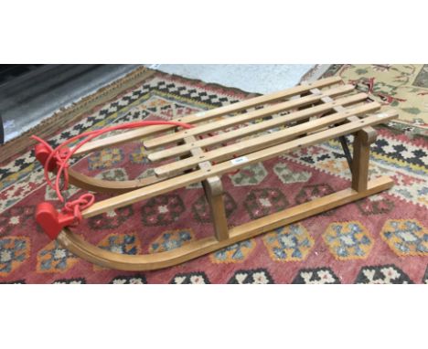 A Gloco Davoser slatted beech sledge with iron runners