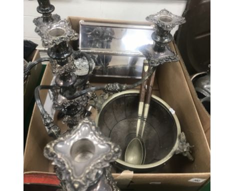 A box of assorted plated wares to include a large table mounted cigar/cigarette box raised on bun feet, a four branch five li