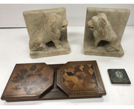 A pair of carved alabaster seated lion bookends, 15.4 cm wide x 10 cm deep x 15.5 cm high, a 19th Century Tunbridge ware adju