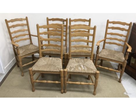 A set of six modern ash ladder back rush seat dining chairs in the 18th Century manner (4 plus 2 carvers)