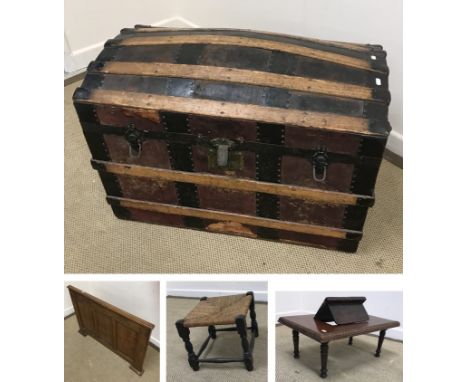 A late Victorian leather covered and strap work decorated dome top captain's trunk, the top with interior compartment, 82 cm 