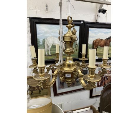 A 20th Century lacquered brass six light electrolier in the Empire taste with figural bust, foliate and scrollwork decoration