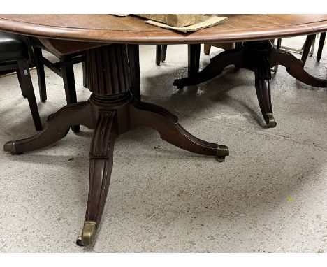 A 19th Century mahogany twin pillar D end dining table with moulded edge on reeded pedestals to hipped moulded tripod bases, 