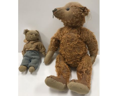 An early 20th Century cinnamon plush teddy bear in the manner of Steiff with boot button eyes, hump back and growler (defunct