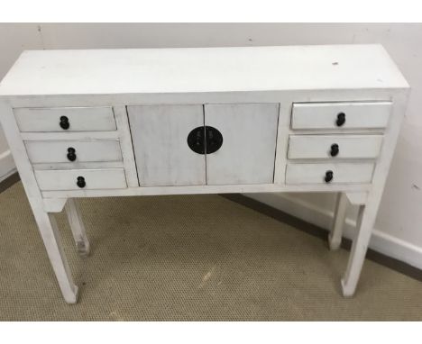 A pair of light oak and cream painted slim chests of six drawers with turned knob handles, 51 cm wide x 36 cm deep x 116.5 cm
