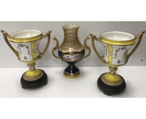 A pair of Royal Crown Derby twin-handled vases with yellow ground and floral sprays and gilt highlights, 17.5 cm high, togeth