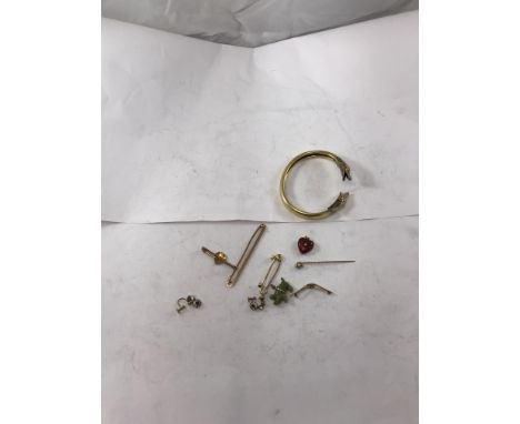 A 9 carat gold stock pin of plain form, 6.4 cm long, 3.7 g together with a 15 carat gold brooch pin 2.8 g, a pair of 9 carat 