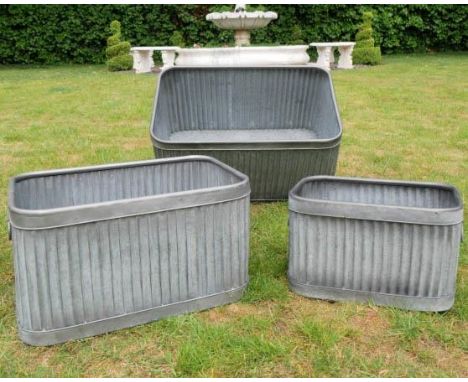 TROUGH PLANTERS, a graduated set of three, 33cm x 60cm x 38cm, galvanized zinc, ribbed design. (2) 