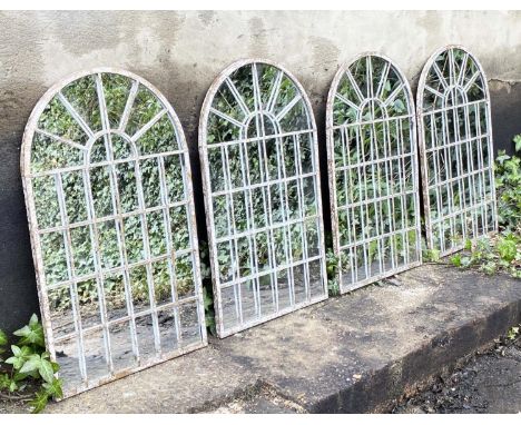 ARCHITECTURAL GARDEN MIRRORS, a set of four, arched metal frames, 60cm x 36cm. (4) 