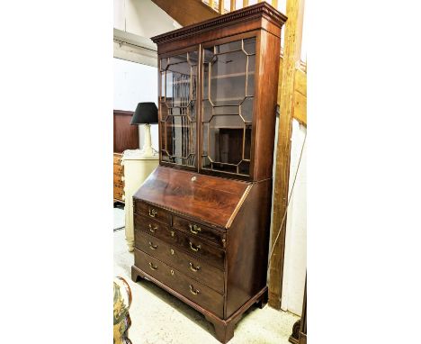 BUREAU BOOKCASE, George III mahogany with two glazed doors enclosing shelves above a fall front, green leather lined writing 