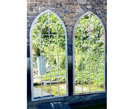 ARCHITECTURAL GARDEN WALL MIRRORS, a pair, 160cm x 67cm, Gothic style aged metal frames. (2) 