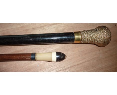 Swagger stick with horn finial and walking stick with brass mounts