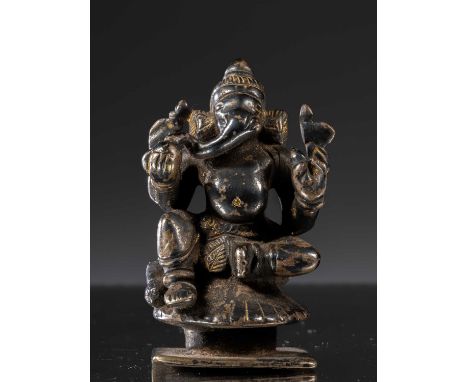 SilverIndia , 18th century&nbsp;Dimensions: Height 7 cm Wide 5 cm Depth 4 cmWeight: 272 gramsSeated Ganesha on round lotus ba