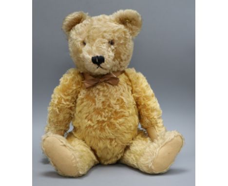 A 1950's Steiff teddy bear, Ralph, with golden mohair, brown and black glass eyes, pronounced muzzle, black stitched nose, mo