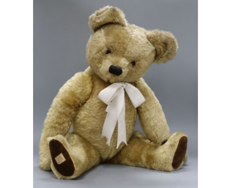 A 1950's Chad Valley teddy bear, Nicky, with golden mohair, deep amber and black glass eyes, black stitched 'button' nose, bl