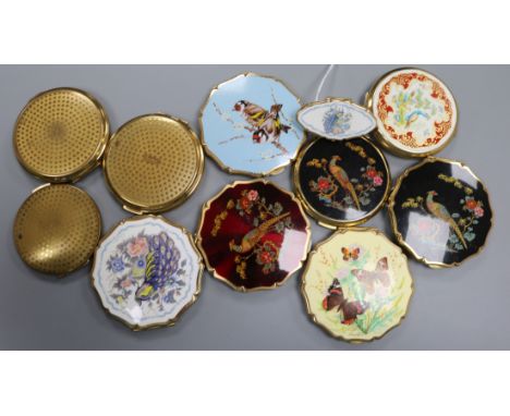 A collection of vintage powder compacts by Stratton, three decorated with pheasants, two with peacocks (one with matching lip