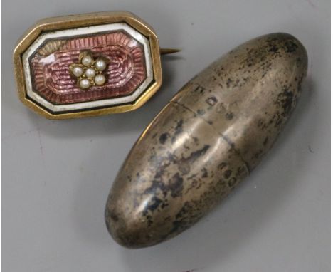 A Victorian silver ovoid vinaigrette by Sampson Mordan, London, 1884 and a 9ct gold, enamel and seed pearl brooch.