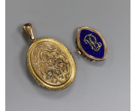 An Edwardian engraved yellow metal locket and a Victorian enamel and diamond set clasp.
