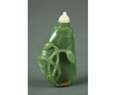 LARGE CHINESE CARVED JADE SNUFF BOTTLE Of elongated ovoid form carved with a wrapping vine, with stopper.   Height 9.5 cm