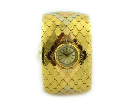VINTAGE 14 KARAT GOLD MIDO WATCH/BRACELET  7.5 inches, weighing approximately 84 grams.