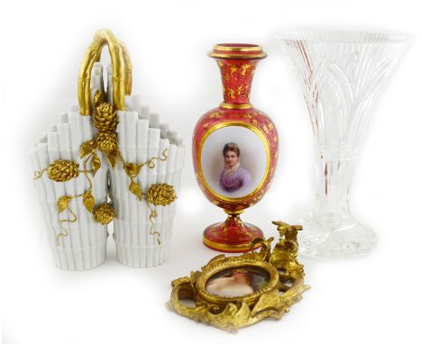 FOUR ASSORTED TABLE ITEMS Comprising a Continental painted porcelain plaque of a maiden, 19th century, signed and with factor