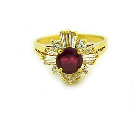 18 KARAT YELLOW GOLD RUBY & DIAMOND RING The round cut ruby weighing approximately 1.20 carats, surrounded by 16 tapered bagu