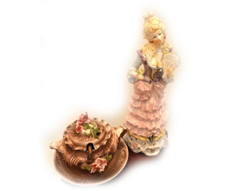 TWO ITALIAN CAPO-DI-MONTE PORCELAIN ITEMS Both modern, with factory marks on the underside; the first an elaborately dressed 